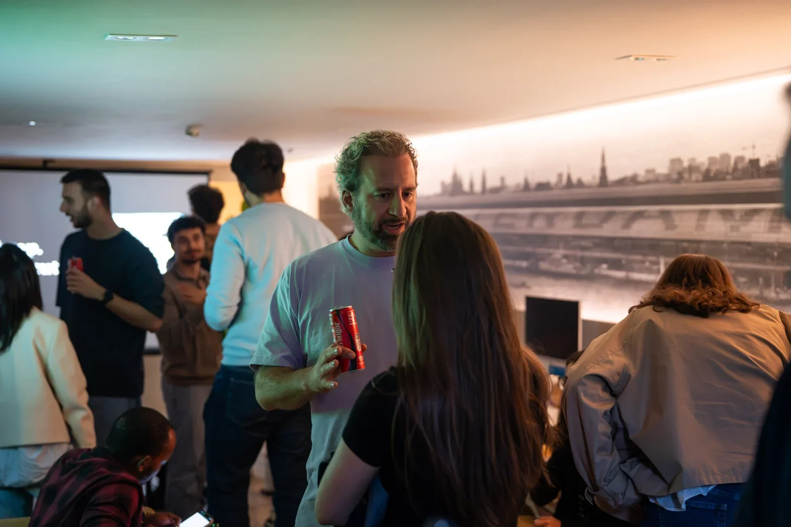 Evan Gelders in conversation over drinks