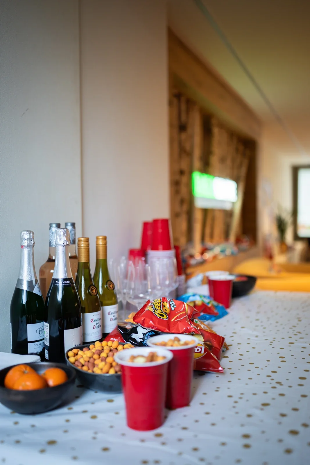 A table with drinks and snacks